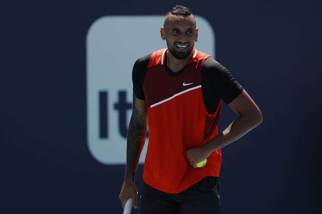 Mar 29, 2022; Miami Gardens, FL, USA; Nick Kyrgios (AUS) smiles between points against Jannik Sinner (ITA)(not pictured) in a fourth round men's singles match in the Miami Open at Hard Rock Stadium. Mandatory Credit: Geoff Burke-USA TODAY Sports