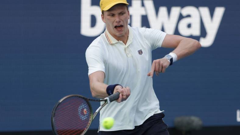 Mar 29, 2022; Miami Gardens, FL, USA; Jenson Brooksby (USA) reacts after winning a point against Daniil Medvedev (not pictured) in a fourth round men's singles match in the Miami Open at Hard Rock Stadium. Mandatory Credit: Geoff Burke-USA TODAY Sports