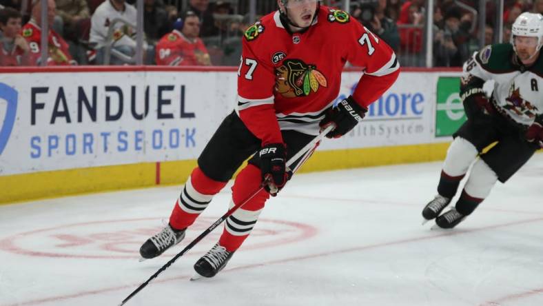 Apr 3, 2022; Chicago, Illinois, USA; Chicago Blackhawks center Kirby Dach (77) with the puck during the first period against the Arizona Coyotes  at the United Center. Mandatory Credit: Dennis Wierzbicki-USA TODAY Sports