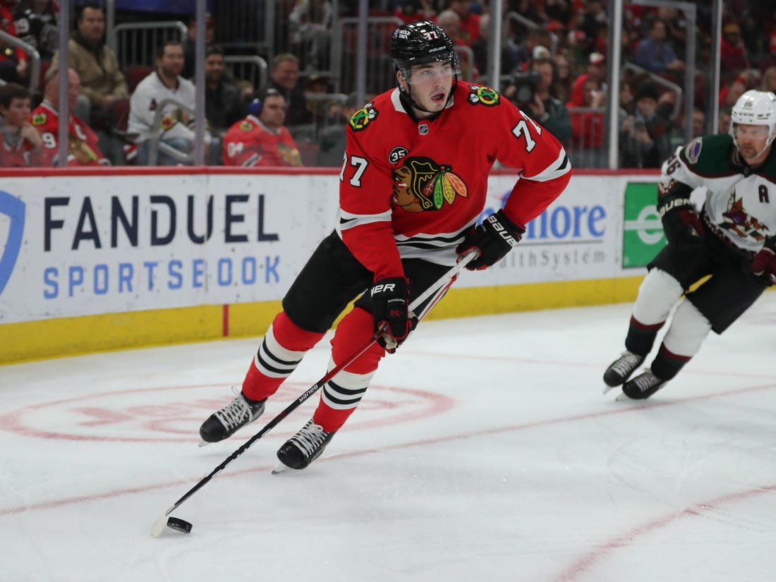 Apr 3, 2022; Chicago, Illinois, USA; Chicago Blackhawks center Kirby Dach (77) with the puck during the first period against the Arizona Coyotes  at the United Center. Mandatory Credit: Dennis Wierzbicki-USA TODAY Sports