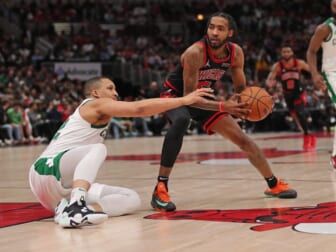 Apr 6, 2022; Chicago, Illinois, USA; Chicago Bulls forward Derrick Jones Jr. (5) being defended by Boston Celtics forward Grant Williams (12) during the second half at the United Center. Mandatory Credit: Dennis Wierzbicki-USA TODAY Sports