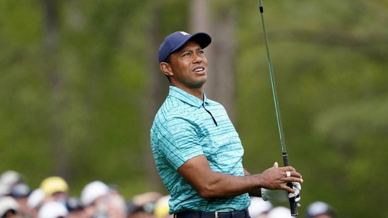 Apr 8, 2022; Augusta, Georgia, USA; Tiger Woods watches his tee shot from no. 12 during the second round of The Masters golf tournament at Augusta National Golf Course. Mandatory Credit: Danielle Parhizkaran-Augusta Chronicle/USA TODAY Sports