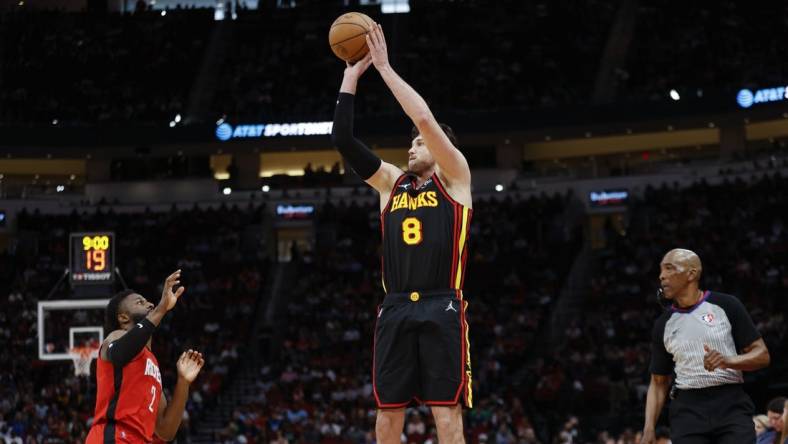 Apr 10, 2022; Houston, Texas, USA; Atlanta Hawks forward Danilo Gallinari (8) shoots the ball as Houston Rockets forward David Nwaba (2) defends during the fourth quarter at Toyota Center. Mandatory Credit: Troy Taormina-USA TODAY Sports