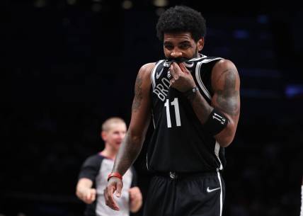 Apr 12, 2022; Brooklyn, New York, USA; Brooklyn Nets guard Kyrie Irving (11) reacts during the first half against the Cleveland Cavaliers at Barclays Center. Mandatory Credit: Vincent Carchietta-USA TODAY Sports