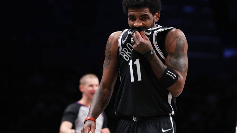 Apr 12, 2022; Brooklyn, New York, USA; Brooklyn Nets guard Kyrie Irving (11) reacts during the first half against the Cleveland Cavaliers at Barclays Center. Mandatory Credit: Vincent Carchietta-USA TODAY Sports