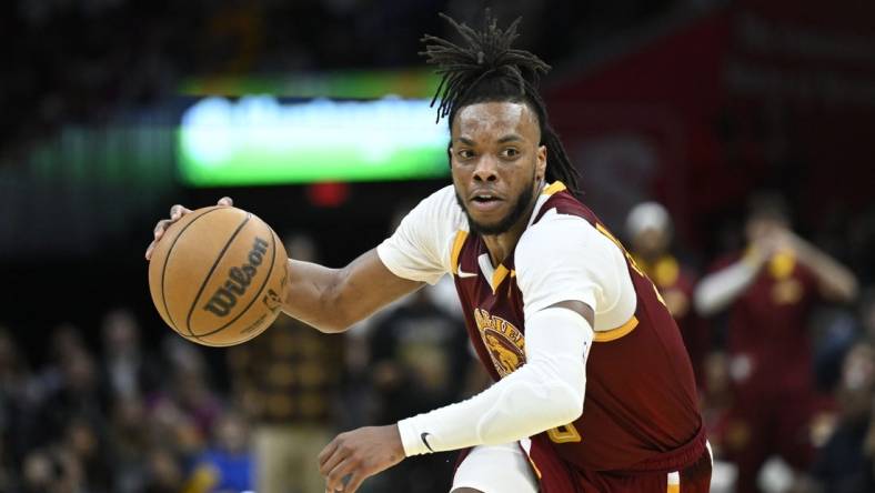 Apr 15, 2022; Cleveland, Ohio, USA; Cleveland Cavaliers guard Darius Garland (10) dribbles the ball in the third quarter against the Atlanta Hawks at Rocket Mortgage FieldHouse. Mandatory Credit: David Richard-USA TODAY Sports