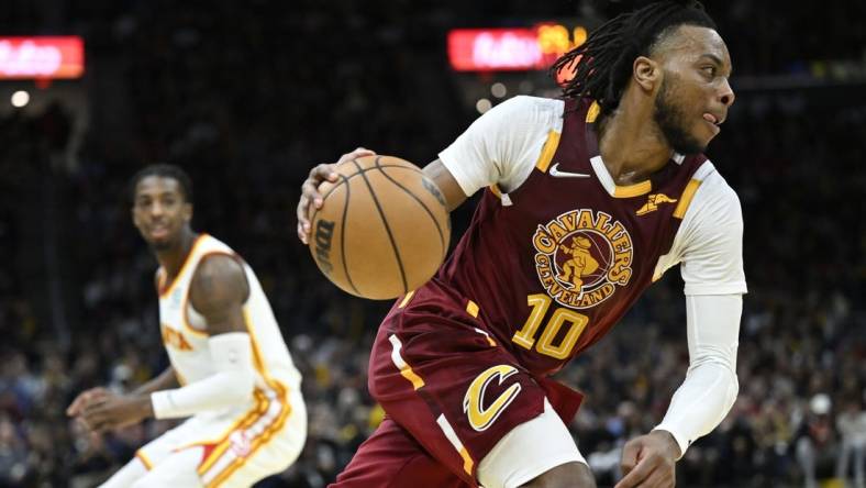 Apr 15, 2022; Cleveland, Ohio, USA; Cleveland Cavaliers guard Darius Garland (10) drives the baseline in the third quarter against the Atlanta Hawks at Rocket Mortgage FieldHouse. Mandatory Credit: David Richard-USA TODAY Sports