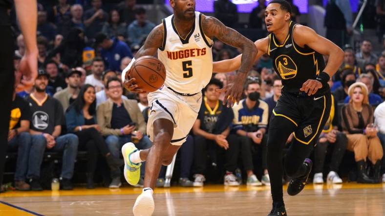 Apr 16, 2022; San Francisco, California, USA; Denver Nuggets guard Will Barton (5) dribbles against Golden State Warriors guard Jordan Poole (3) in the first quarter during game one of the first round for the 2022 NBA playoffs at the Chase Center. Mandatory Credit: Cary Edmondson-USA TODAY Sports