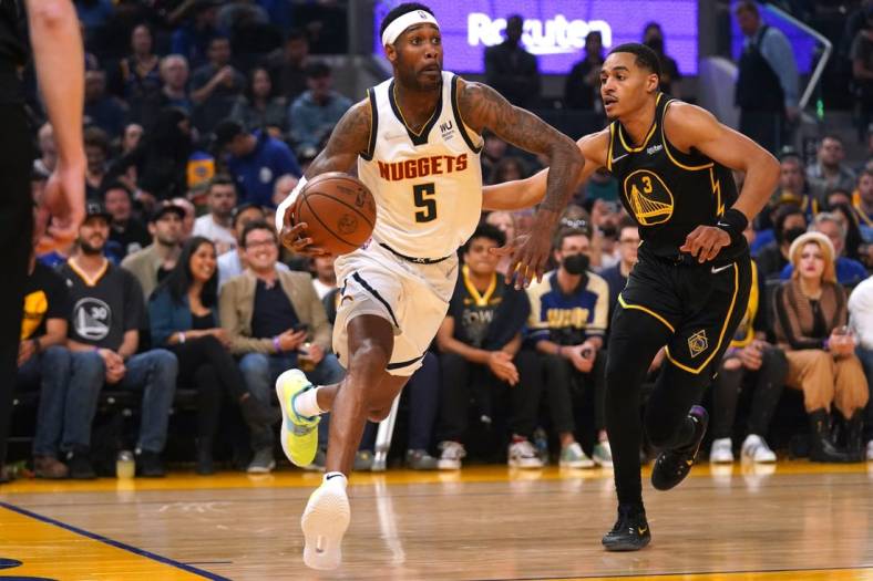 Apr 16, 2022; San Francisco, California, USA; Denver Nuggets guard Will Barton (5) dribbles against Golden State Warriors guard Jordan Poole (3) in the first quarter during game one of the first round for the 2022 NBA playoffs at the Chase Center. Mandatory Credit: Cary Edmondson-USA TODAY Sports