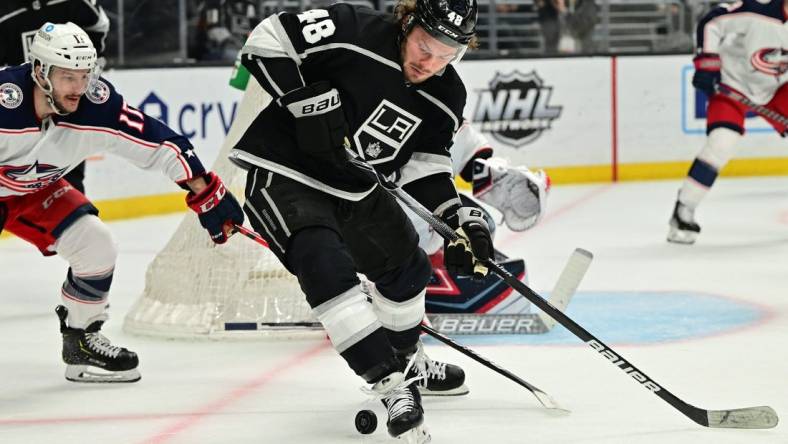 Apr 16, 2022; Los Angeles, California, USA;  Los Angeles Kings left wing Brendan Lemieux (48) is defended by Columbus Blue Jackets right wing Justin Danforth (17) as he handles the puck in front of the goal in the second period of the game at Crypto.com Arena. Mandatory Credit: Jayne Kamin-Oncea-USA TODAY Sports