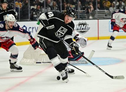 Apr 16, 2022; Los Angeles, California, USA;  Los Angeles Kings left wing Brendan Lemieux (48) is defended by Columbus Blue Jackets right wing Justin Danforth (17) as he handles the puck in front of the goal in the second period of the game at Crypto.com Arena. Mandatory Credit: Jayne Kamin-Oncea-USA TODAY Sports