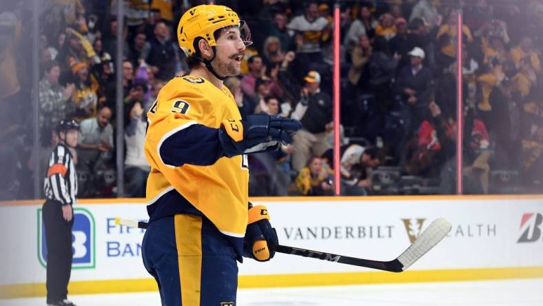 Apr 19, 2022; Nashville, Tennessee, USA; Nashville Predators left wing Filip Forsberg (9) reacts after scoring during the second period against the Calgary Flames at Bridgestone Arena. Mandatory Credit: Christopher Hanewinckel-USA TODAY Sports