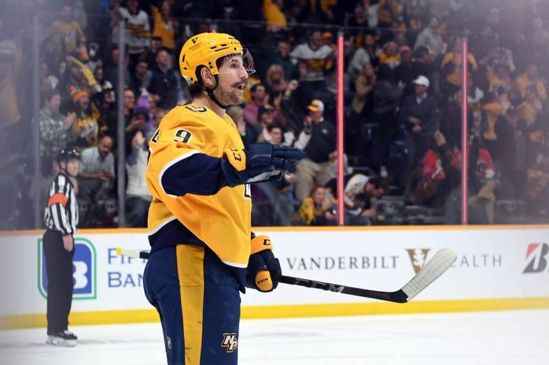 Apr 19, 2022; Nashville, Tennessee, USA; Nashville Predators left wing Filip Forsberg (9) reacts after scoring during the second period against the Calgary Flames at Bridgestone Arena. Mandatory Credit: Christopher Hanewinckel-USA TODAY Sports
