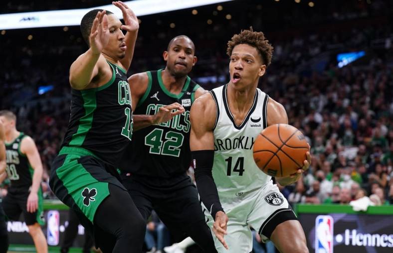 Apr 17, 2022; Boston, Massachusetts, USA; Brooklyn Nets forward Kessler Edwards (14) drives the ball against Boston Celtics forward Grant Williams (12) and center Al Horford (42) in the first quarter during game one of the first round for the 2022 NBA playoffs at TD Garden. Mandatory Credit: David Butler II-USA TODAY Sports