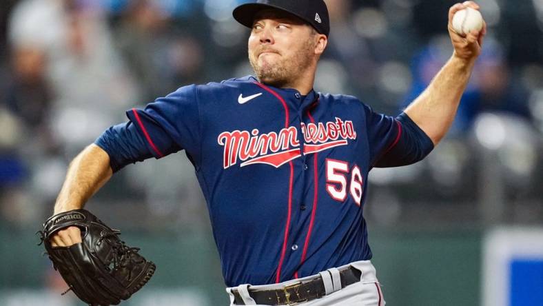 Apr 20, 2022; Kansas City, Missouri, USA; Minnesota Twins relief pitcher Caleb Thielbar (56) pitches against the Kansas City Royals during the sixth inning at Kauffman Stadium. Mandatory Credit: Jay Biggerstaff-USA TODAY Sports