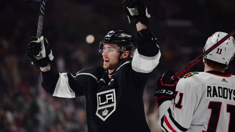 Apr 21, 2022; Los Angeles, California, USA; Los Angeles Kings center Adrian Kempe (9) celebrates the goal scored by center Anze Kopitar (11) against the Chicago Blackhawks during the second period at Crypto.com Arena.  Kempe provided an assist on the goal. Mandatory Credit: Gary A. Vasquez-USA TODAY Sports