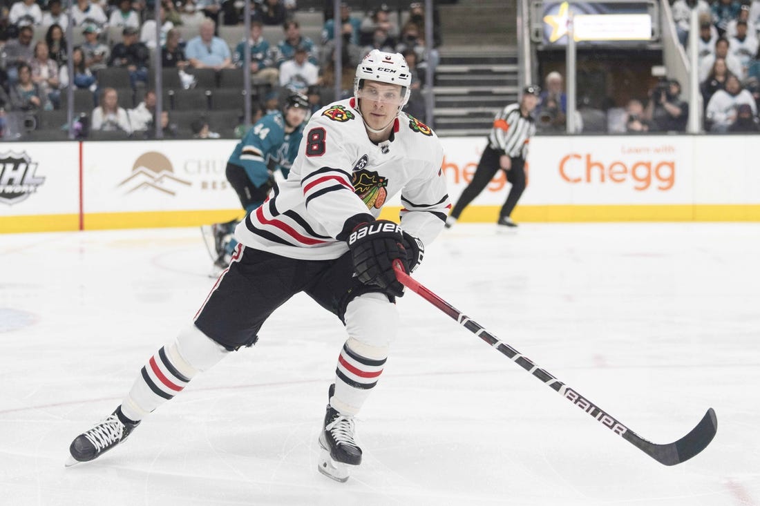 Apr 23, 2022; San Jose, California, USA;  Chicago Blackhawks left wing Dominik Kubalik (8) reaches for the puck during the first period against the San Jose Sharks at SAP Center at San Jose. Mandatory Credit: Stan Szeto-USA TODAY Sports