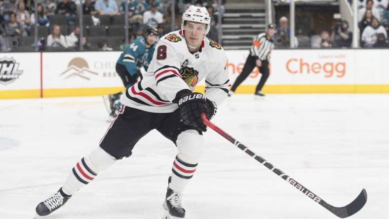 Apr 23, 2022; San Jose, California, USA;  Chicago Blackhawks left wing Dominik Kubalik (8) reaches for the puck during the first period against the San Jose Sharks at SAP Center at San Jose. Mandatory Credit: Stan Szeto-USA TODAY Sports