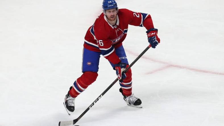 Apr 21, 2022; Montreal, Quebec, CAN; Montreal Canadiens defenseman Jeff Petry (26) makes a pass against Philadelphia Flyers during the second period at Bell Centre. Mandatory Credit: Jean-Yves Ahern-USA TODAY Sports