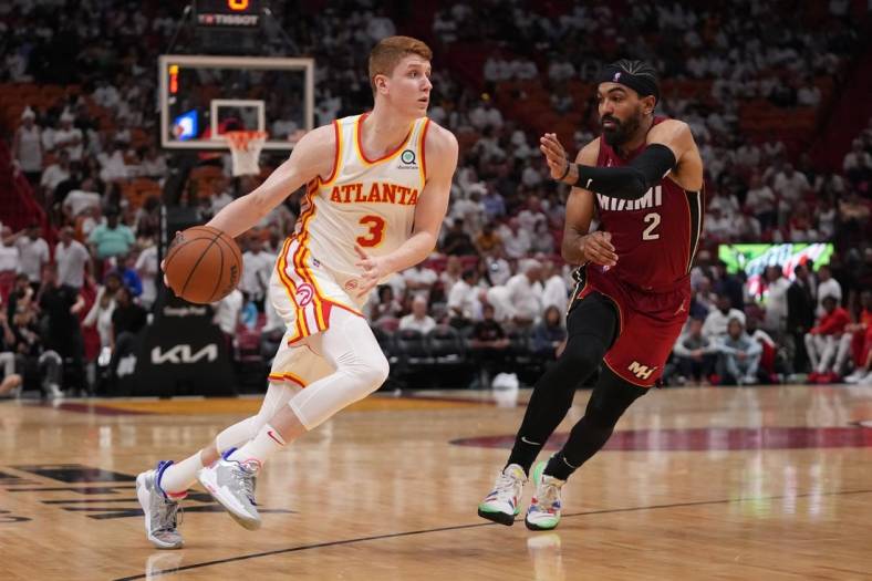 Apr 26, 2022; Miami, Florida, USA; Atlanta Hawks guard Kevin Huerter (3) drives the ball around Miami Heat guard Gabe Vincent (2) during the second half in game five of the first round for the 2022 NBA playoffs at FTX Arena. Mandatory Credit: Jasen Vinlove-USA TODAY Sports