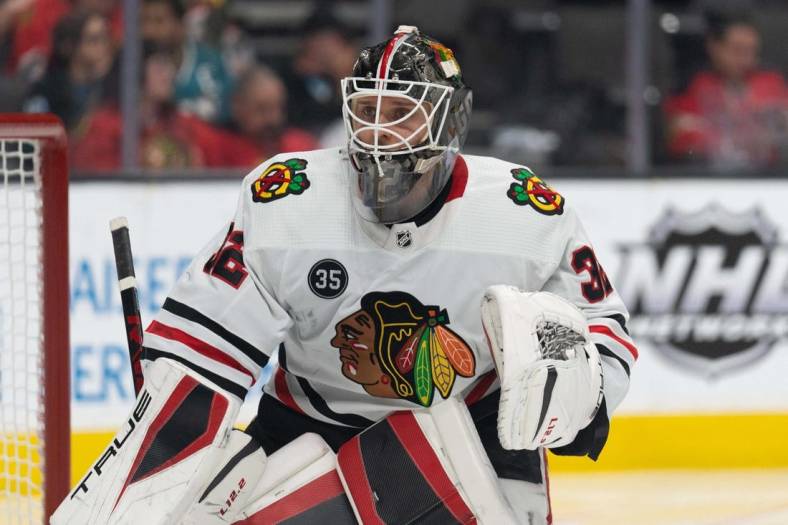 Apr 23, 2022; San Jose, California, USA;  Chicago Blackhawks goaltender Kevin Lankinen (32) watches the puck during the first period against the San Jose Sharks at SAP Center at San Jose. Mandatory Credit: Stan Szeto-USA TODAY Sports