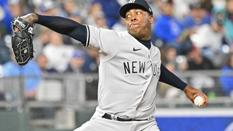 Apr 30, 2022; Kansas City, Missouri, USA;  New York Yankees relief pitcher Aroldis Chapman (54) delivers a pitch during the ninth inning against the Kansas City Royals at Kauffman Stadium. Mandatory Credit: Peter Aiken-USA TODAY Sports