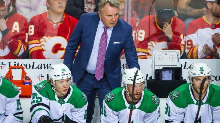 May 3, 2022; Calgary, Alberta, CAN; Dallas Stars head coach Rick Bowness on his bench during the first period against the Calgary Flames in game one of the first round of the 2022 Stanley Cup Playoffs at Scotiabank Saddledome. Mandatory Credit: Sergei Belski-USA TODAY Sports