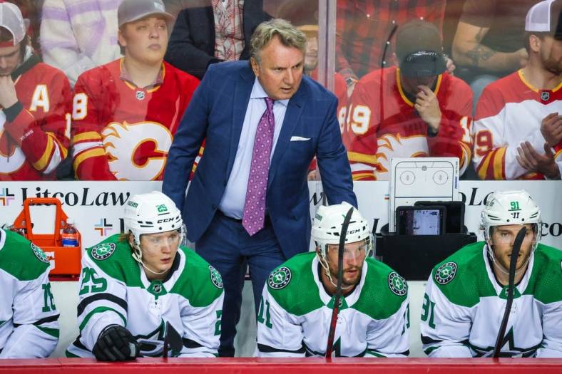 May 3, 2022; Calgary, Alberta, CAN; Dallas Stars head coach Rick Bowness on his bench during the first period against the Calgary Flames in game one of the first round of the 2022 Stanley Cup Playoffs at Scotiabank Saddledome. Mandatory Credit: Sergei Belski-USA TODAY Sports