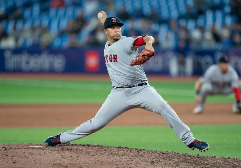 Apr 28, 2022; Toronto, Ontario, CAN; Boston Red Sox relief pitcher Hansel Robles (57)  throws a pitch during the eighth inning against the Toronto Blue Jays at Rogers Centre. Mandatory Credit: Nick Turchiaro-USA TODAY Sports