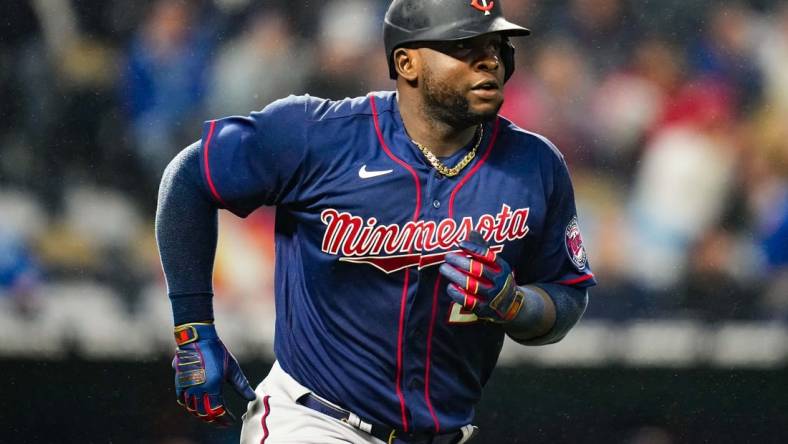 Apr 20, 2022; Kansas City, Missouri, USA; Minnesota Twins first baseman Miguel Sano (22) runs to first base during the fifth inning against the Kansas City Royals at Kauffman Stadium. Mandatory Credit: Jay Biggerstaff-USA TODAY Sports