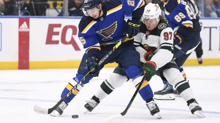 May 8, 2022; St. Louis, Missouri, USA; Minnesota Wild left wing Kirill Kaprizov (97) pressures St. Louis Blues center Jordan Kyrou (25) during the first period in game four of the first round of the 2022 Stanley Cup Playoffs at Enterprise Center. Mandatory Credit: Jeff Le-USA TODAY Sports