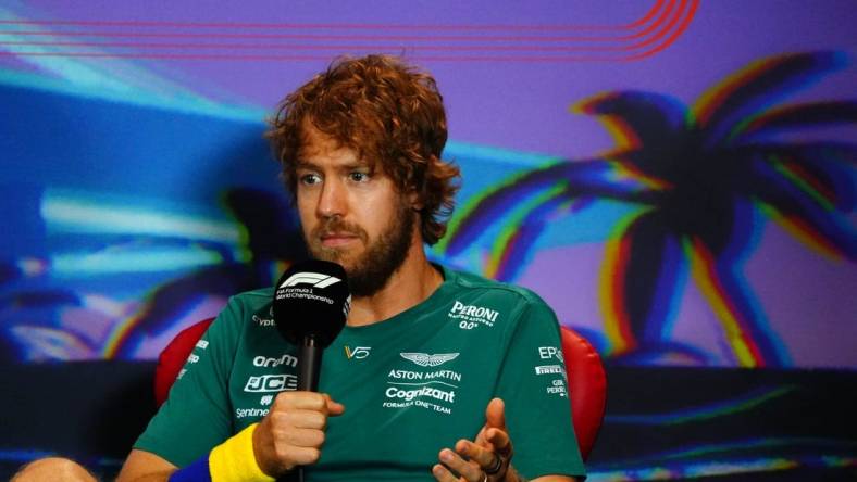 May 6, 2022; Miami Gardens, Florida, USA; Aston Martin driver Sebastian Vettel of Germany talks with the media during a press conference before their practice session for the Miami Grand Prix at Miami International Autodrome. Mandatory Credit: John David Mercer-USA TODAY Sports