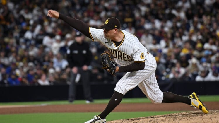 May 9, 2022; San Diego, California, USA; San Diego Padres relief pitcher Craig Stammen (34) throws a pitch against the Chicago Cubs during the sixth inning at Petco Park. Mandatory Credit: Orlando Ramirez-USA TODAY Sports
