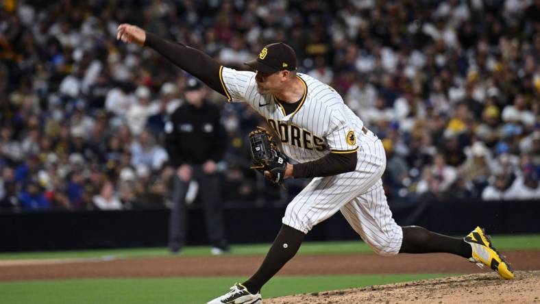 May 9, 2022; San Diego, California, USA; San Diego Padres relief pitcher Craig Stammen (34) throws a pitch against the Chicago Cubs during the sixth inning at Petco Park. Mandatory Credit: Orlando Ramirez-USA TODAY Sports