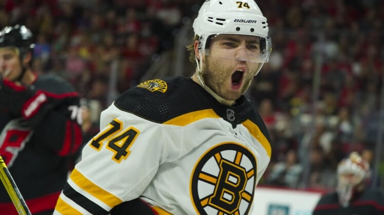 May 14, 2022; Raleigh, North Carolina, USA; Boston Bruins left wing Jake DeBrusk (74) celebrates his goal against the Carolina Hurricanes during the second period in game seven of the first round of the 2022 Stanley Cup Playoffs at PNC Arena. Mandatory Credit: James Guillory-USA TODAY Sports