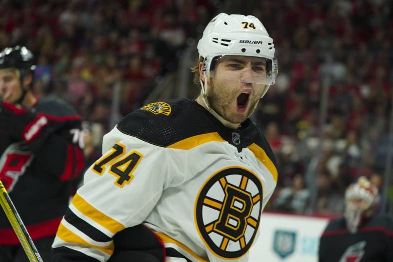 May 14, 2022; Raleigh, North Carolina, USA; Boston Bruins left wing Jake DeBrusk (74) celebrates his goal against the Carolina Hurricanes during the second period in game seven of the first round of the 2022 Stanley Cup Playoffs at PNC Arena. Mandatory Credit: James Guillory-USA TODAY Sports
