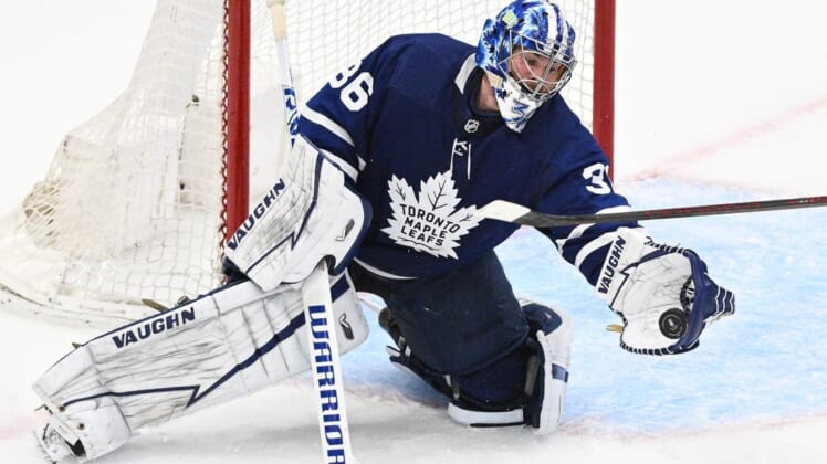 May 14, 2022; Toronto, Ontario, CAN;  Toronto Maple Leafs goalie Jack Campbell (36) makes a glove save against the Tampa Bay Lightning in game seven of the first round of the 2022 Stanley Cup Playoffs at Scotiabank Arena. Mandatory Credit: Dan Hamilton-USA TODAY Sports