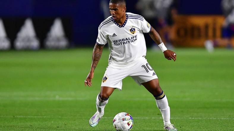 May 14, 2022; Carson, California, USA; Los Angeles Galaxy forward Douglas Costa (10) controls the ball against FC Dallas during the second half at Dignity Health Sports Park. Mandatory Credit: Gary A. Vasquez-USA TODAY Sports