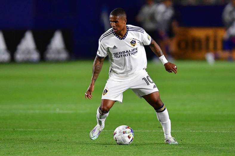May 14, 2022; Carson, California, USA; Los Angeles Galaxy forward Douglas Costa (10) controls the ball against FC Dallas during the second half at Dignity Health Sports Park. Mandatory Credit: Gary A. Vasquez-USA TODAY Sports