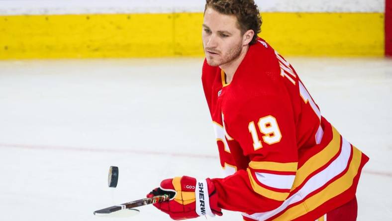 May 15, 2022; Calgary, Alberta, CAN; Calgary Flames left wing Matthew Tkachuk (19) controls the puck during the warmup period against the Dallas Stars in game seven of the first round of the 2022 Stanley Cup Playoffs at Scotiabank Saddledome. Mandatory Credit: Sergei Belski-USA TODAY Sports