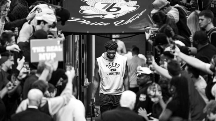 May 12, 2022; Philadelphia, Pennsylvania, USA; (original photo converted to black and white) Philadelphia 76ers center Joel Embiid walks from his locker room for warm ups against the Miami Heat in game six of the second round of the 2022 NBA playoffs at Wells Fargo Center. Mandatory Credit: Bill Streicher-USA TODAY Sports