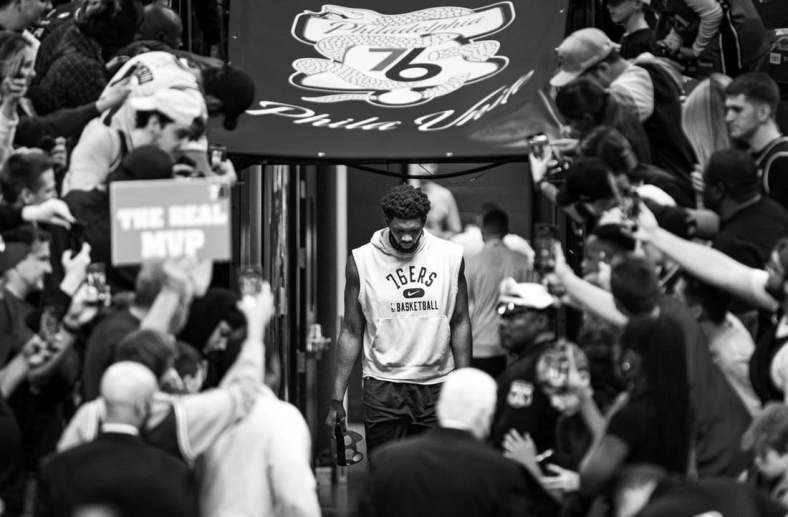 May 12, 2022; Philadelphia, Pennsylvania, USA; (original photo converted to black and white) Philadelphia 76ers center Joel Embiid walks from his locker room for warm ups against the Miami Heat in game six of the second round of the 2022 NBA playoffs at Wells Fargo Center. Mandatory Credit: Bill Streicher-USA TODAY Sports