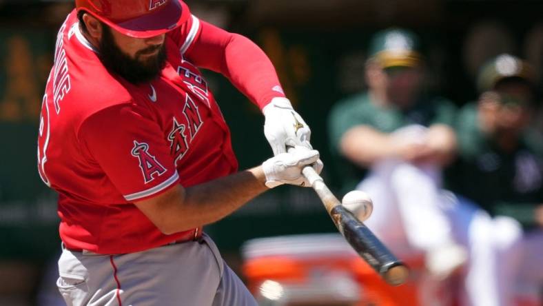 May 14, 2022; Oakland, California, USA; Los Angeles Angels catcher Austin Romine (19) bats against the Oakland Athletics during the fourth inning at RingCentral Coliseum. Mandatory Credit: Darren Yamashita-USA TODAY Sports