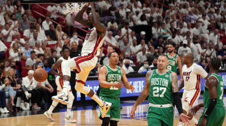 May 17, 2022; Miami, Florida, USA; Miami Heat center Dewayne Dedmon (21) dunks against the Boston Celtics during the first half of game one of the 2022 eastern conference finals at FTX Arena. Mandatory Credit: Jasen Vinlove-USA TODAY Sports