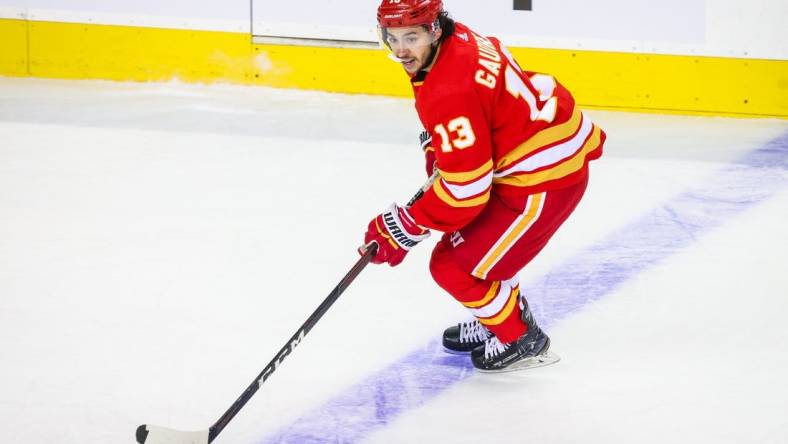 May 18, 2022; Calgary, Alberta, CAN; Calgary Flames left wing Johnny Gaudreau (13) skates with the puck against the Edmonton Oilers during the first period in game one of the second round of the 2022 Stanley Cup Playoffs at Scotiabank Saddledome. Mandatory Credit: Sergei Belski-USA TODAY Sports