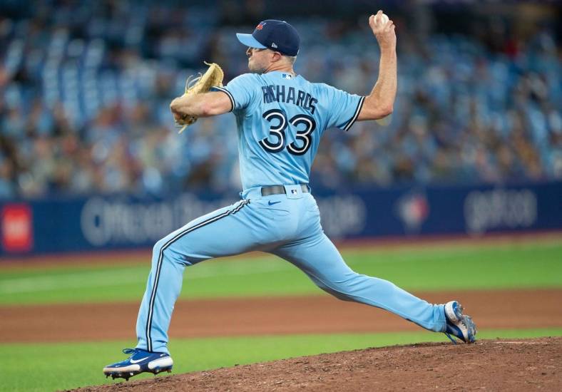 May 16, 2022; Toronto, Ontario, CAN; Toronto Blue Jays relief pitcher Trevor Richards (33) throws a pitch against the Seattle Mariners during the seventh inning at Rogers Centre. Mandatory Credit: Nick Turchiaro-USA TODAY Sports