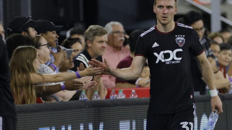 May 21, 2022; Washington, District of Columbia, USA; D.C. United defender Julian Gressel (31) shakes hands with fans while leaving the field after the game against Toronto FC at Audi Field. Mandatory Credit: Geoff Burke-USA TODAY Sports