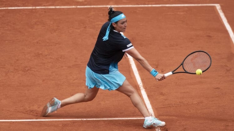 May 22, 2022; Paris, France;  Ons Jabeur (TUN) returns the ball during her match against Magda Linette (POL) on day one of the French Open at Stade Roland-Garros. Mandatory Credit: Susan Mullane-USA TODAY Sports
