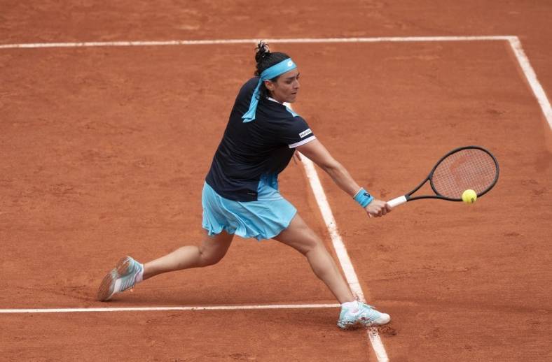 May 22, 2022; Paris, France;  Ons Jabeur (TUN) returns the ball during her match against Magda Linette (POL) on day one of the French Open at Stade Roland-Garros. Mandatory Credit: Susan Mullane-USA TODAY Sports