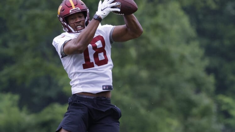 May 24, 2022; Asburn, VA, USA; Washington Commanders wide receiver Antonio Gandy-Golden (18) catches a pass during drills as part of OTAs at The Park in Ashburn. Mandatory Credit: Geoff Burke-USA TODAY Sports